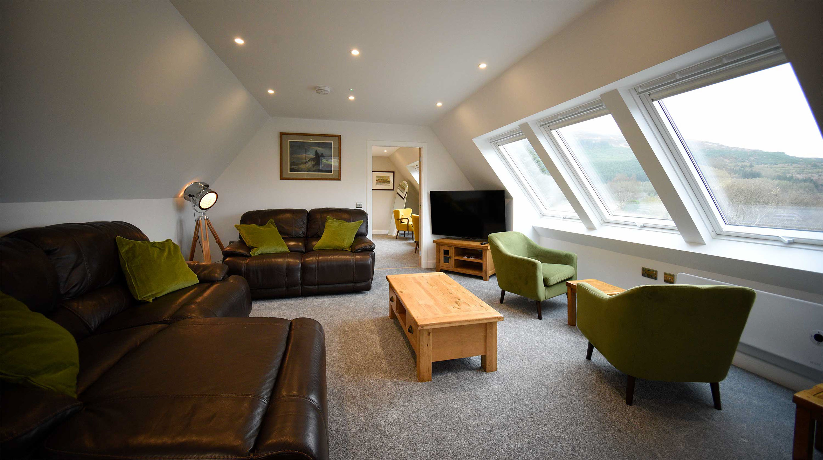 The Old Workshop self catering accommodation contains a spacious living room with sea and mountain views of the Isle of Skye
